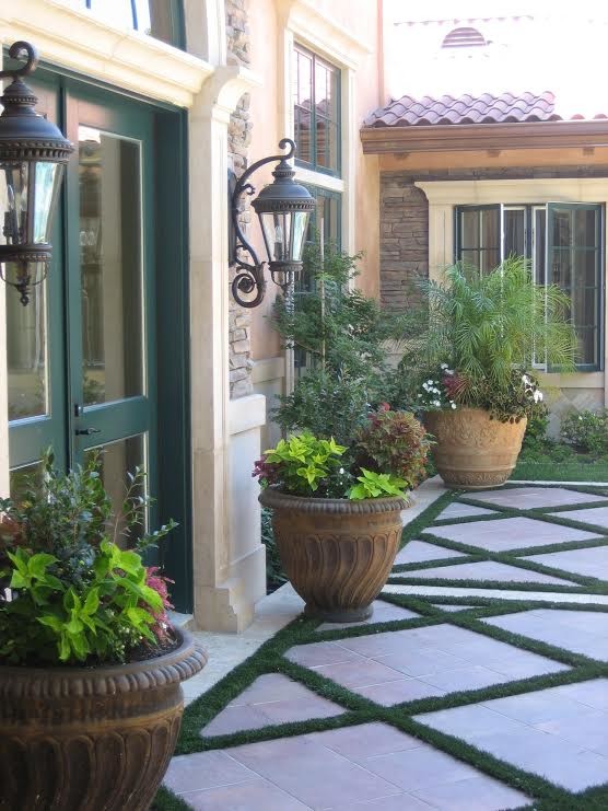 Inspiration for a large mediterranean two-storey brown house exterior in Sacramento with mixed siding and a tile roof.