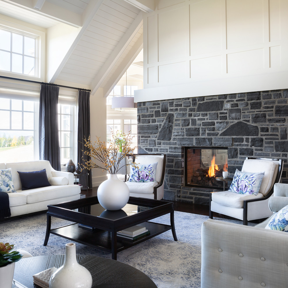 Inspiration for a large transitional formal open concept living room in Calgary with white walls, dark hardwood floors, a two-sided fireplace, a stone fireplace surround and brown floor.