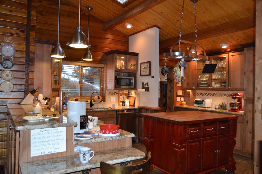Example of a mountain style kitchen design in Seattle with light wood cabinets