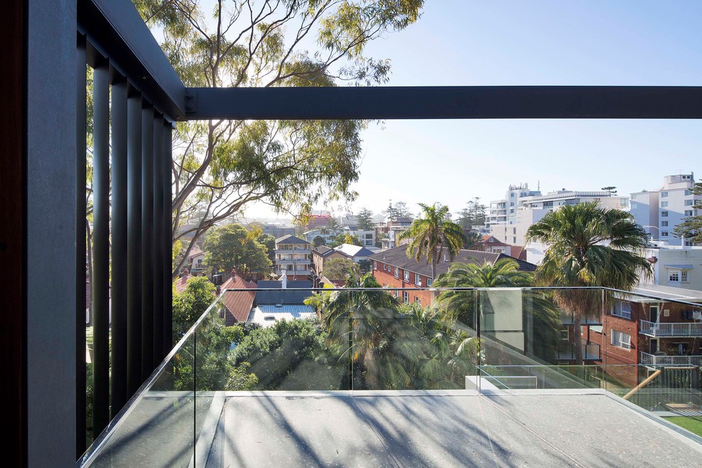 Contemporary balcony in Sydney with glass railing.