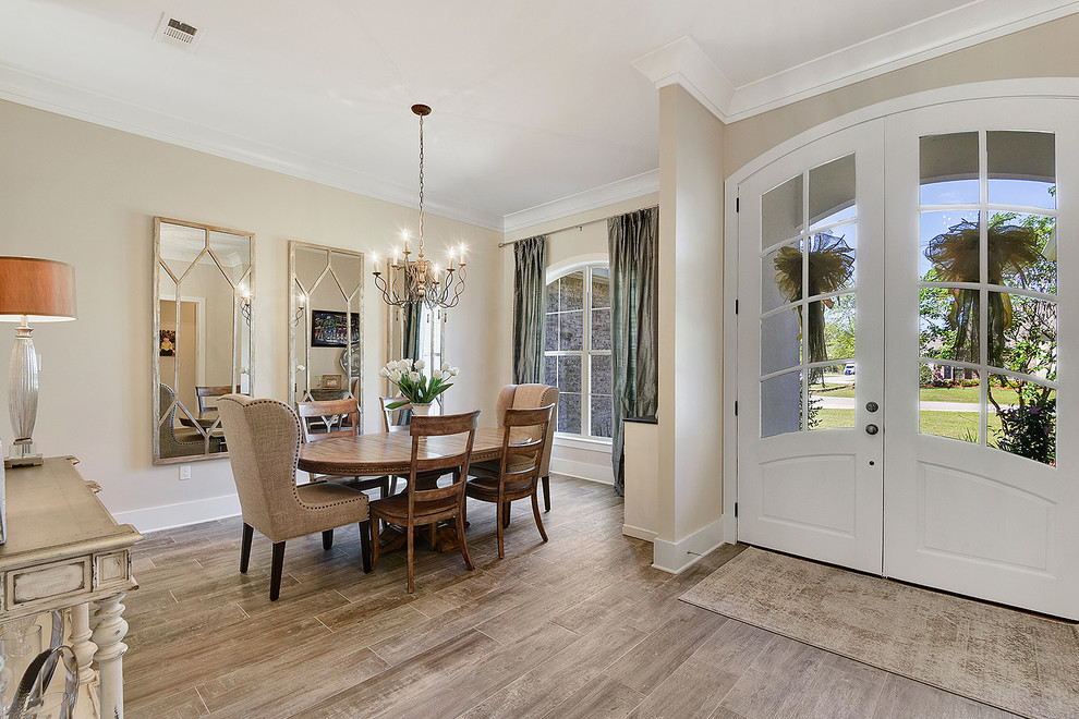 Small transitional open plan dining in New Orleans with beige walls, no fireplace, brown floor and porcelain floors.