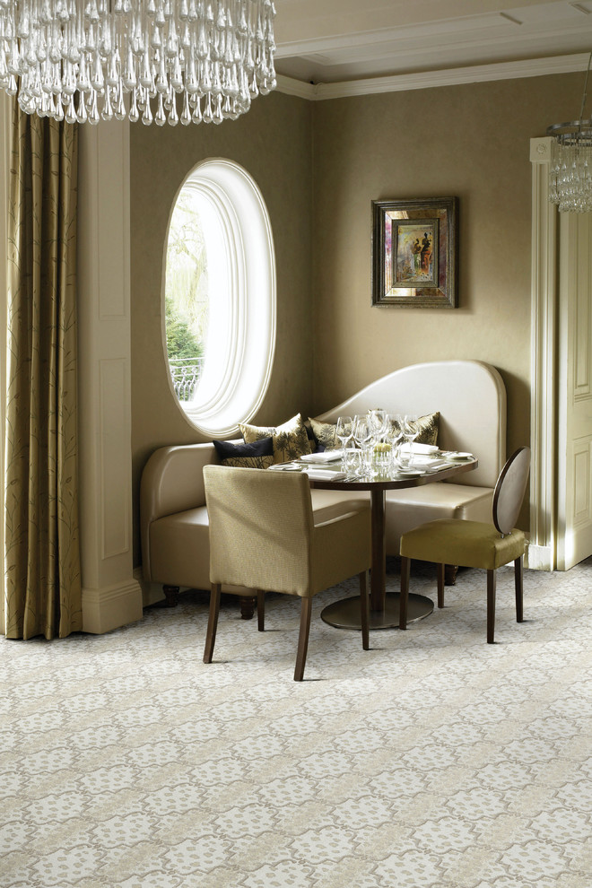 Inspiration for a small traditional dining room in Other with brown walls and carpet.