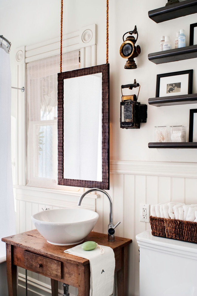 Inspiration for a mid-sized eclectic master bathroom in San Francisco with a vessel sink, open cabinets, a shower/bathtub combo, a one-piece toilet, white walls, dark hardwood floors, wood benchtops, dark wood cabinets and brown benchtops.
