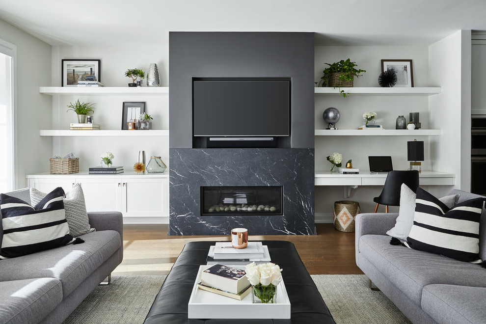 Photo of a transitional family room in Toronto with white walls, dark hardwood floors, a ribbon fireplace, a stone fireplace surround and a built-in media wall.