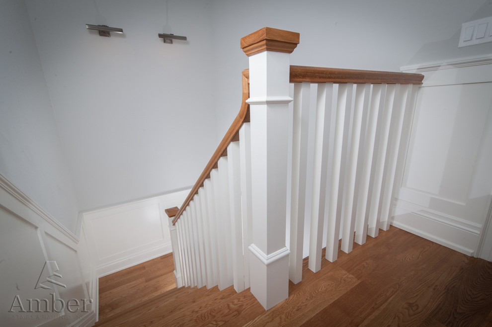Photo of a large contemporary wood straight staircase in Toronto with wood risers.