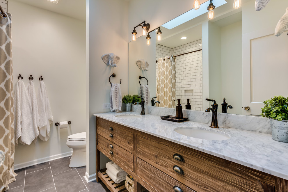 Transitional 3/4 bathroom in Chicago with flat-panel cabinets, medium wood cabinets, white tile, subway tile, white walls, an undermount sink, grey floor, a shower curtain and grey benchtops.