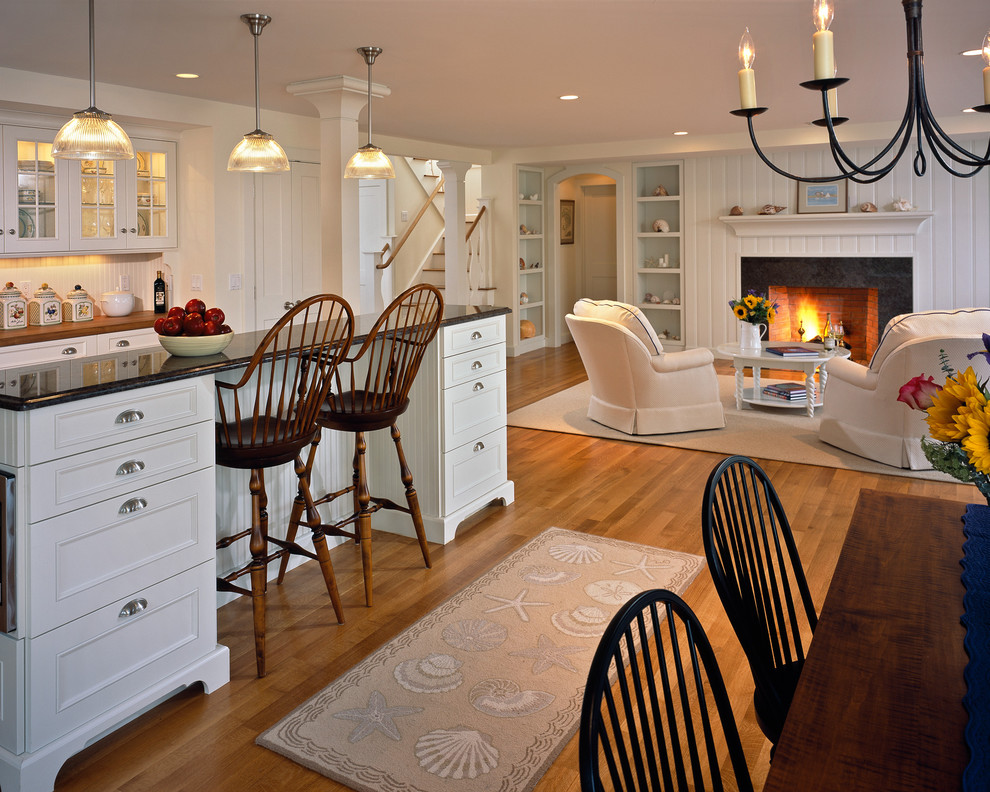 Beach style open plan kitchen in Boston with recessed-panel cabinets and white cabinets.