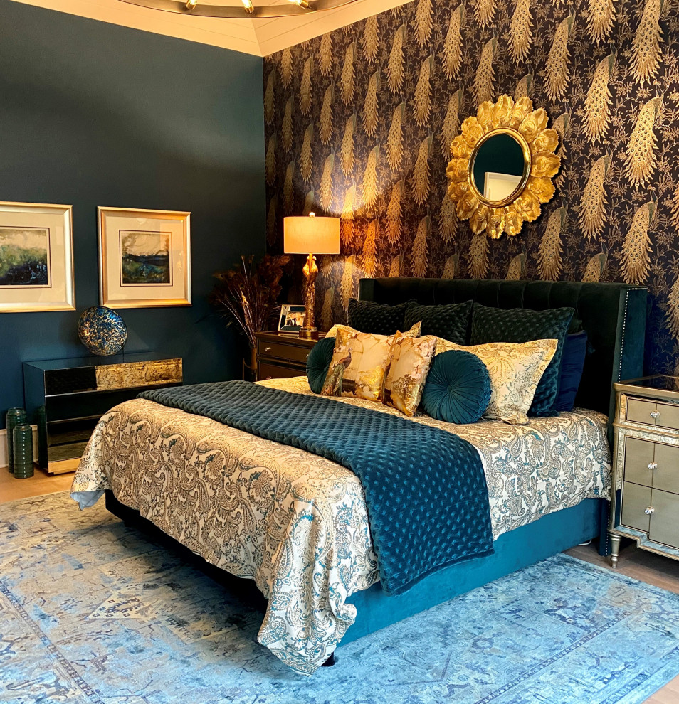 Large modern master bedroom in Charlotte with blue walls, light hardwood floors, multi-coloured floor, vaulted and wallpaper.