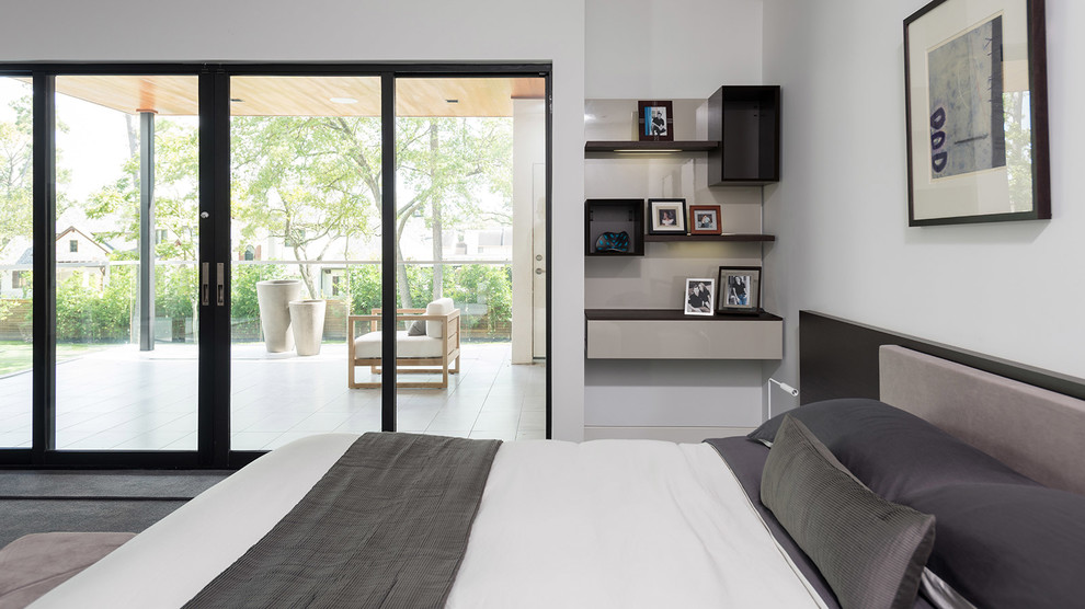 Photo of a modern bedroom in Houston.