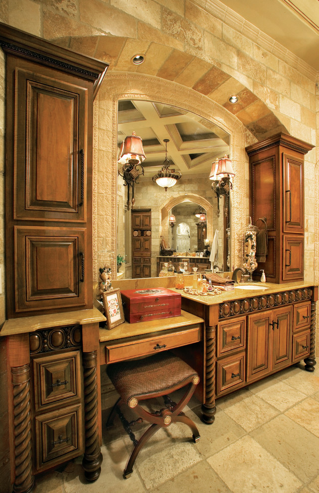 Inspiration for an expansive mediterranean master bathroom in Miami with raised-panel cabinets, medium wood cabinets, granite benchtops, a drop-in tub, an alcove shower, beige tile, stone tile, multi-coloured walls and travertine floors.