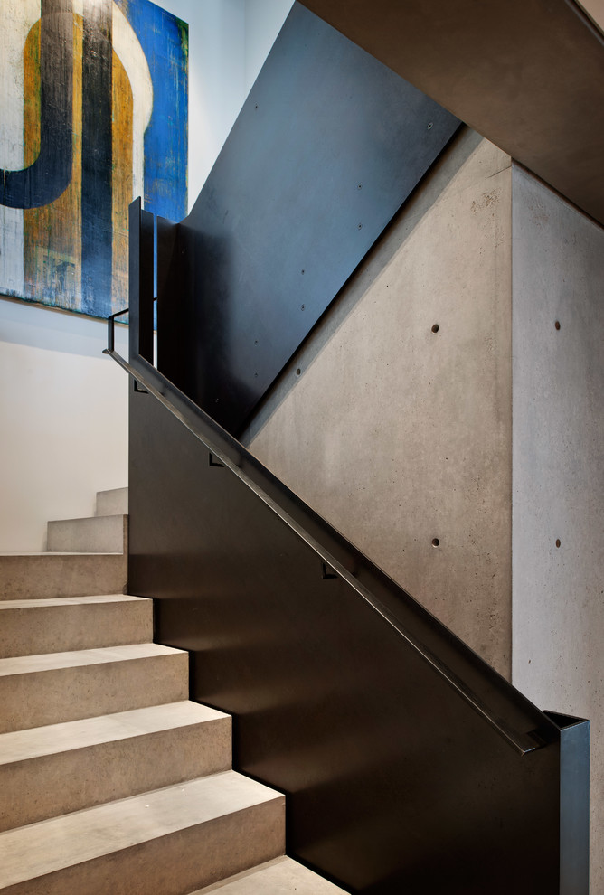 Photo of a contemporary concrete staircase in Seattle with concrete risers.