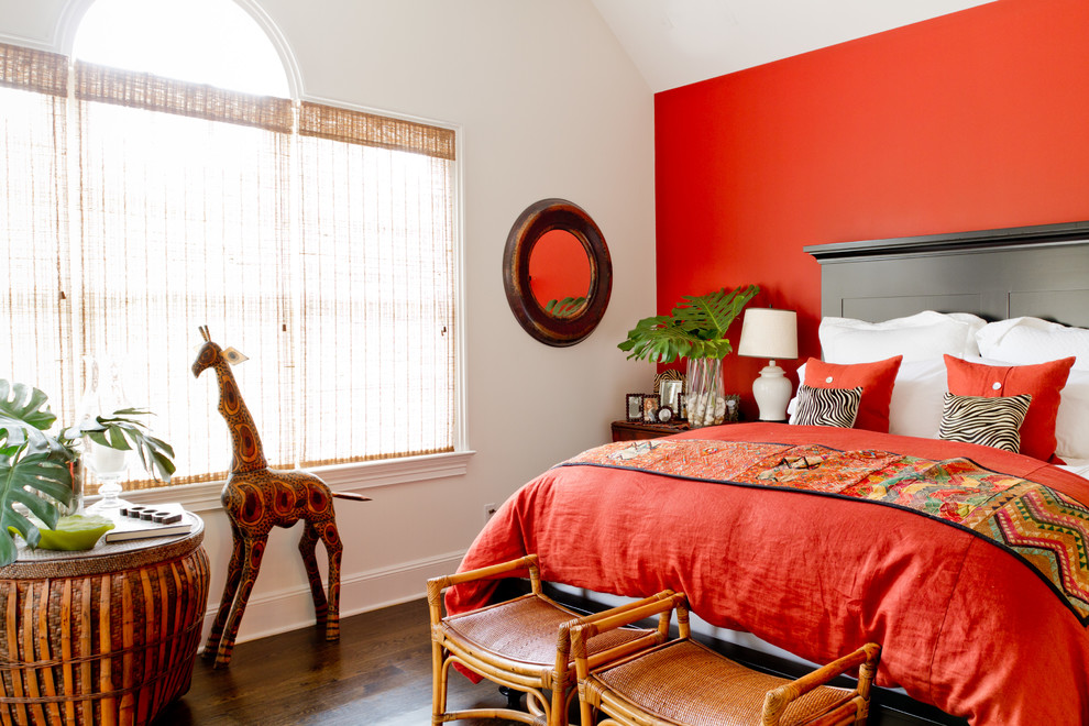 Inspiration for a traditional bedroom in New York with red walls.