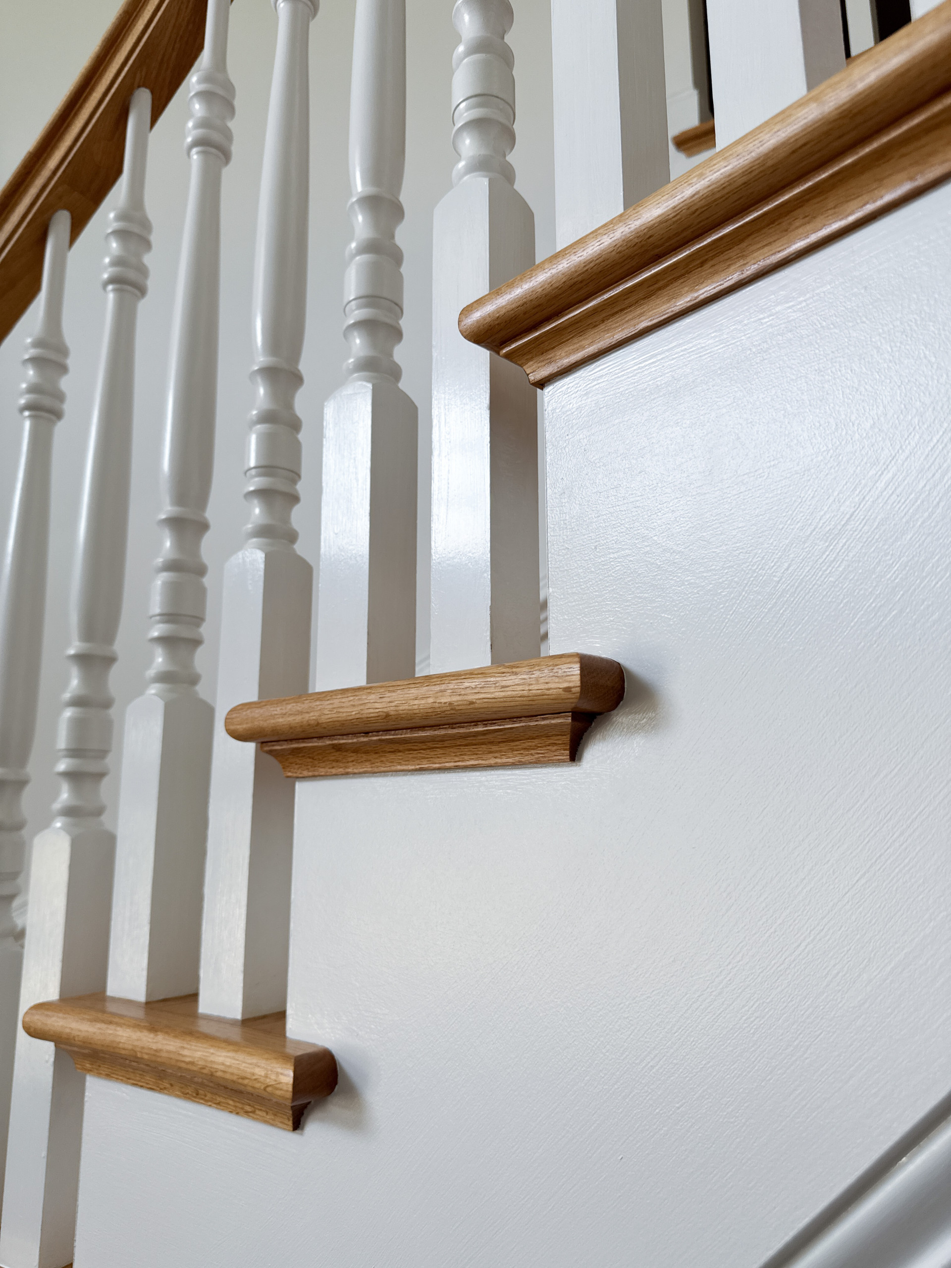 Project #161 | Curved Red Oak Foyer Staircase, 26 Years Later