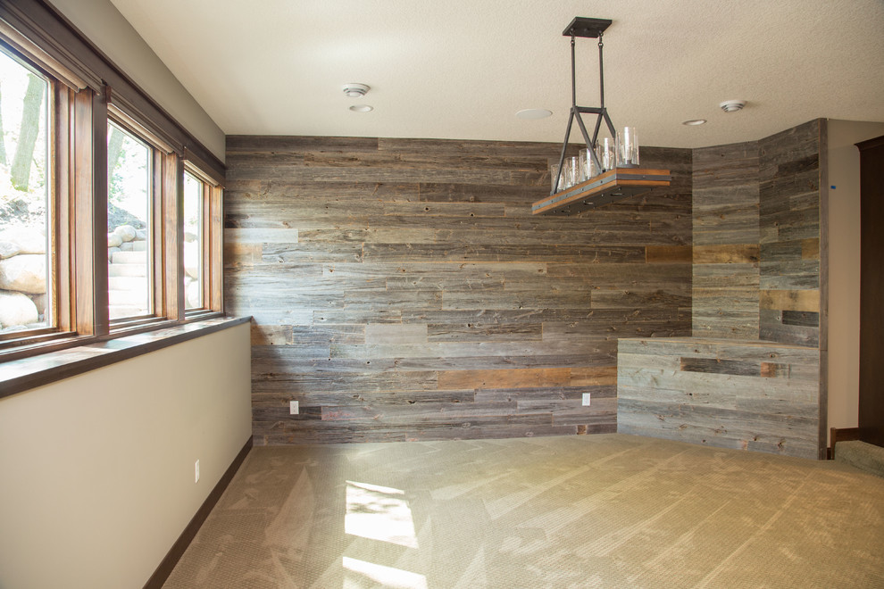 Inspiration for a transitional look-out carpeted basement remodel in Minneapolis with gray walls