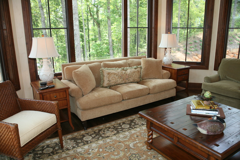 Traditional family room in Other with dark hardwood floors.