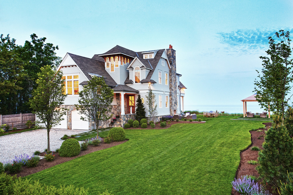 White three-story wood gable roof photo in New York