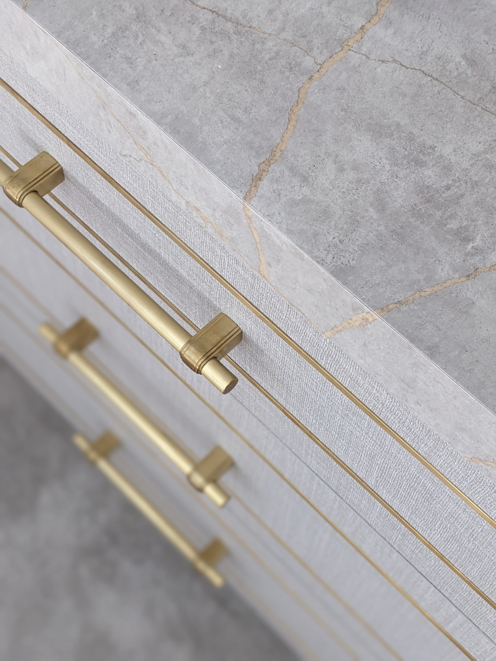 Joinery details: marble top, brass inlays and handles
