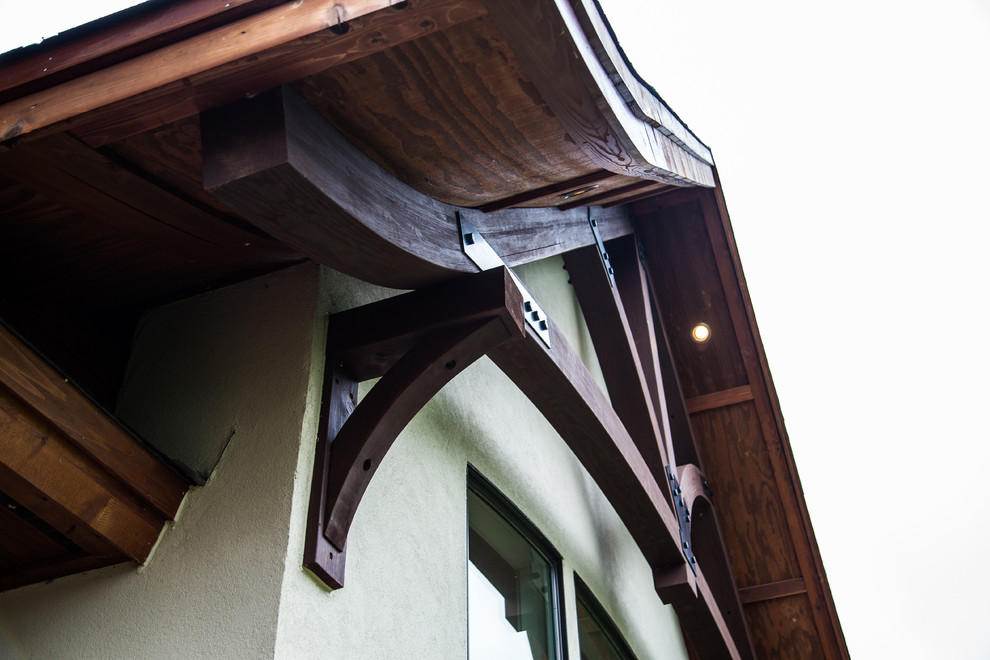 Example of a transitional three-story mixed siding gable roof design in Minneapolis with a shingle roof