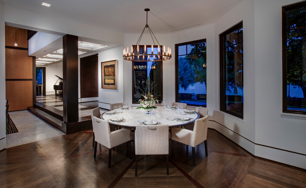 Inspiration for a contemporary open plan dining in Orlando with white walls, dark hardwood floors and no fireplace.
