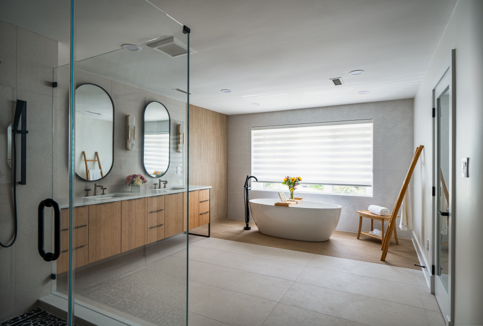 Large asian master beige tile and ceramic tile porcelain tile, beige floor and double-sink bathroom photo in DC Metro with flat-panel cabinets, medium tone wood cabinets, an undermount tub, a one-piece toilet, beige walls, an undermount sink, quartzite countertops, white countertops and a freestanding vanity