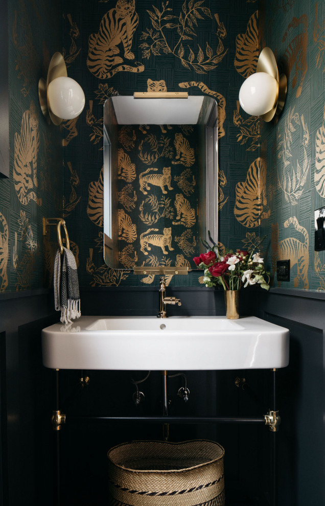 This is an example of a transitional powder room in Chicago with black walls and wallpaper.