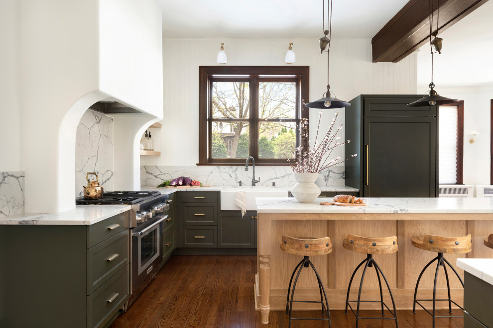 Inspiration for a large l-shaped kitchen pantry in Other with a farmhouse sink, shaker cabinets, green cabinets, quartzite benchtops, multi-coloured splashback, engineered quartz splashback, panelled appliances, dark hardwood floors, with island, brown floor, white benchtop and exposed beam.