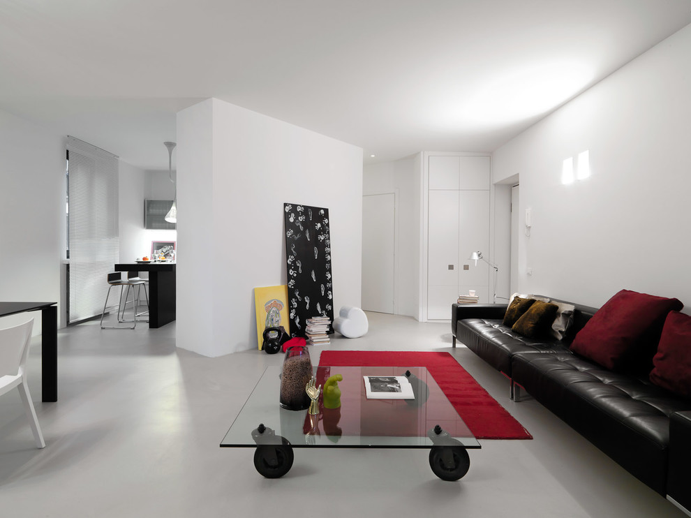 Design ideas for a modern open concept living room in Turin with white walls.