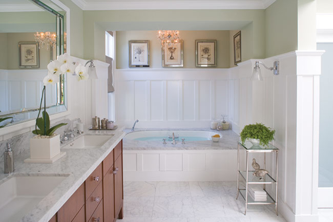 Inspiration for a large traditional master bathroom in Los Angeles with an undermount sink, furniture-like cabinets, medium wood cabinets, marble benchtops, a drop-in tub, a one-piece toilet, stone tile, green walls and marble floors.
