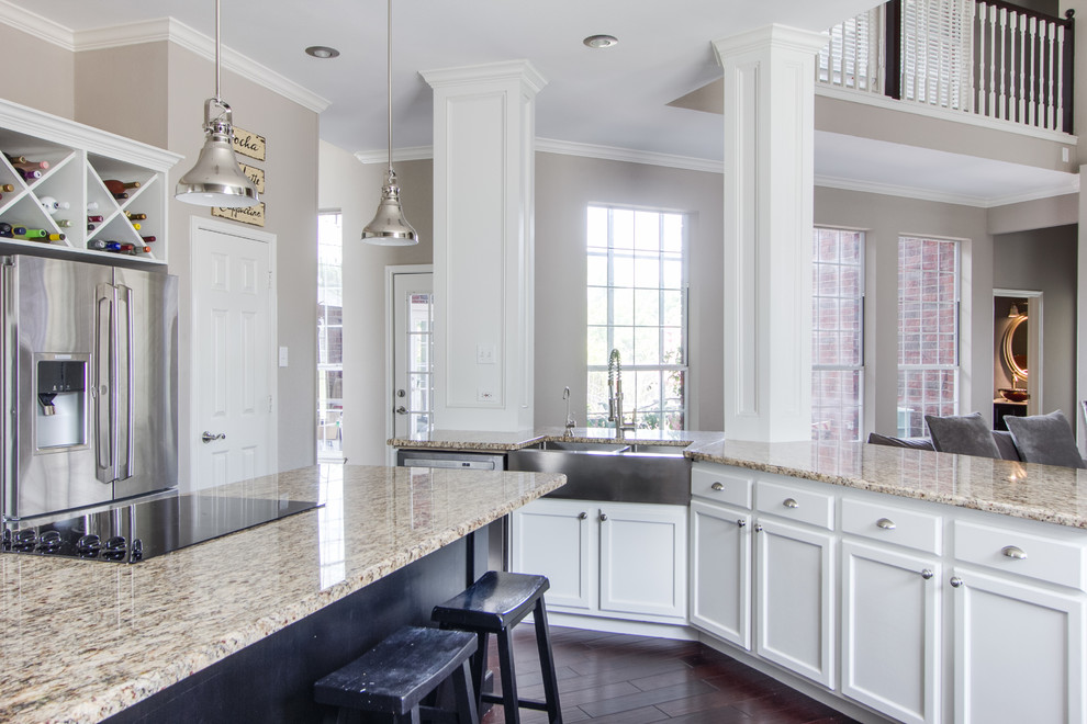 Inspiration for a mid-sized transitional eat-in kitchen in Dallas with a double-bowl sink, shaker cabinets, white cabinets, granite benchtops, multi-coloured splashback, stainless steel appliances, dark hardwood floors and with island.