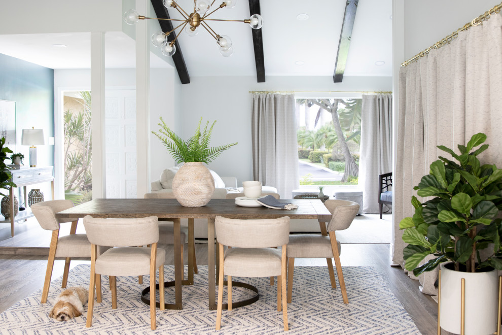 Design ideas for a contemporary dining room in Miami with white walls, dark hardwood floors, brown floor and vaulted.