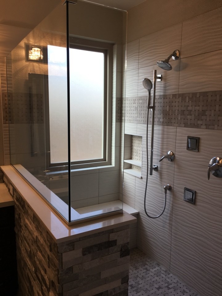 Design ideas for a large contemporary master bathroom in Phoenix with recessed-panel cabinets, dark wood cabinets, an open shower, beige tile, an undermount sink, quartzite benchtops and an open shower.