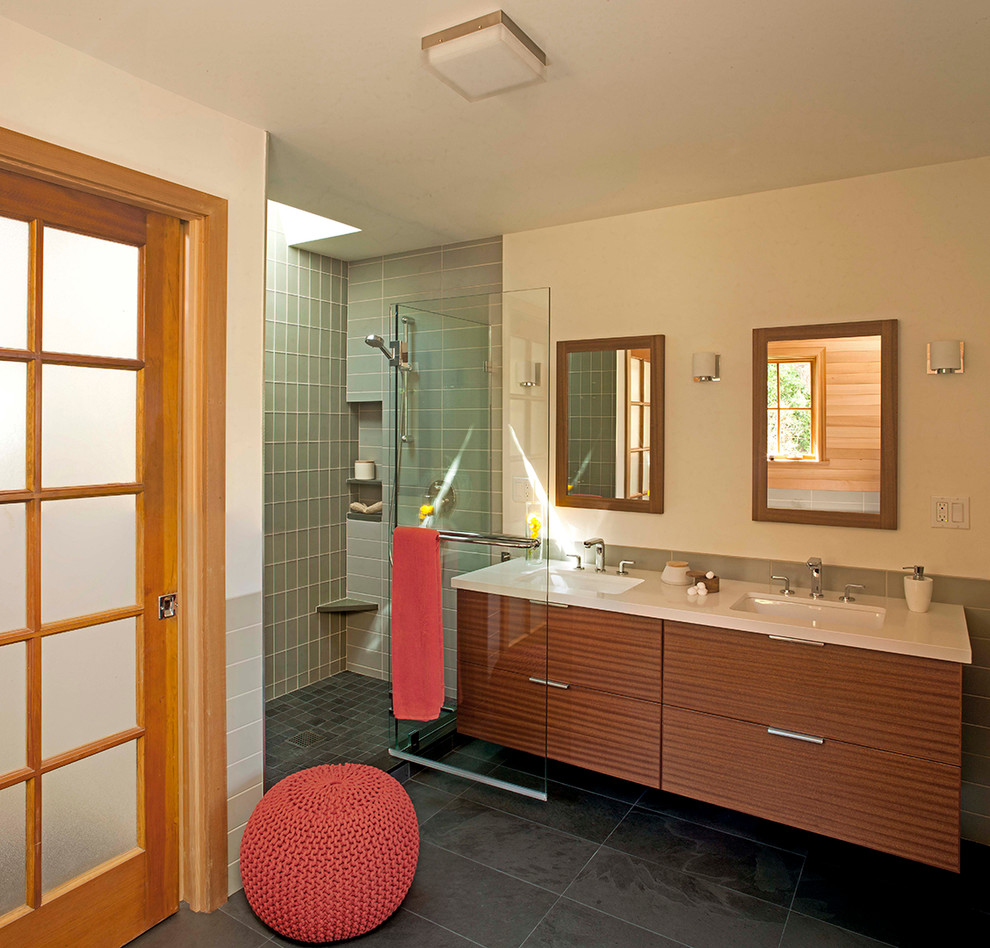 Design ideas for a mid-sized master bathroom in San Francisco with flat-panel cabinets, dark wood cabinets, a drop-in tub, an alcove shower, a two-piece toilet, green tile, subway tile, beige walls, slate floors, an undermount sink and tile benchtops.