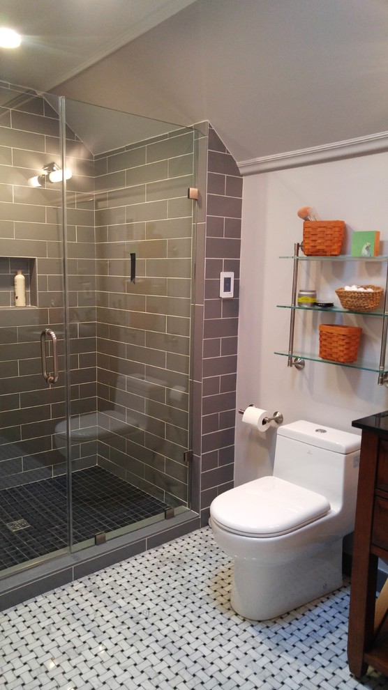 Design ideas for a small transitional master bathroom in DC Metro with furniture-like cabinets, dark wood cabinets, an alcove shower, black and white tile, glass sheet wall, an undermount sink and marble benchtops.