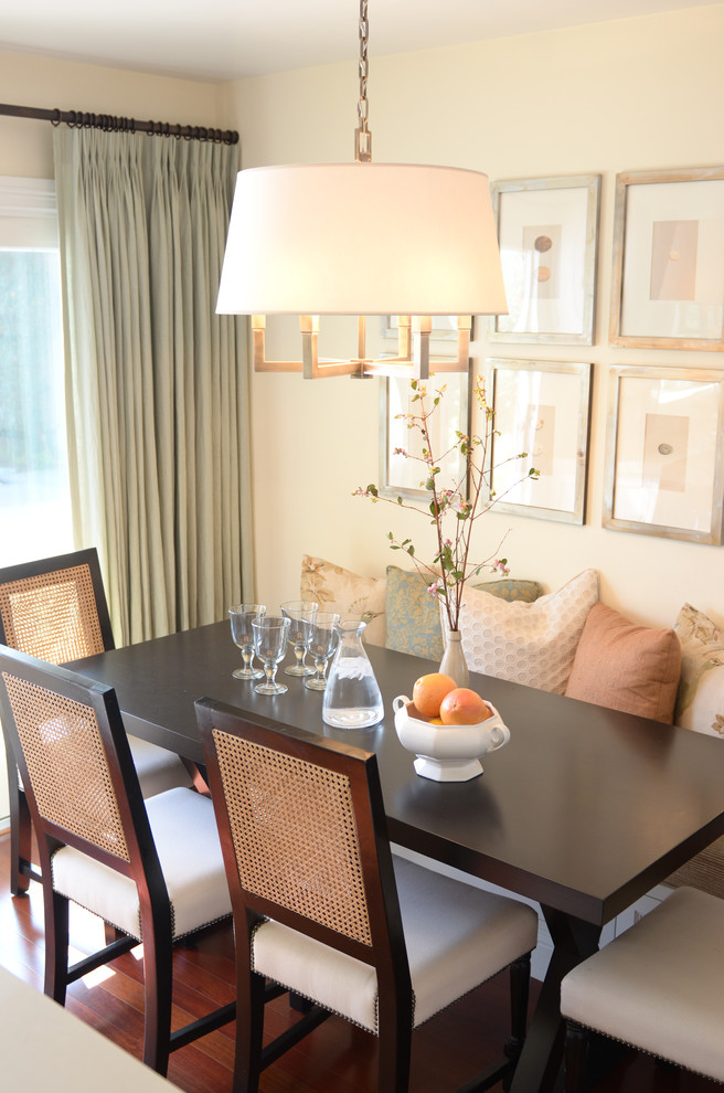 Small transitional medium tone wood floor kitchen/dining room combo photo in Orange County with beige walls and no fireplace
