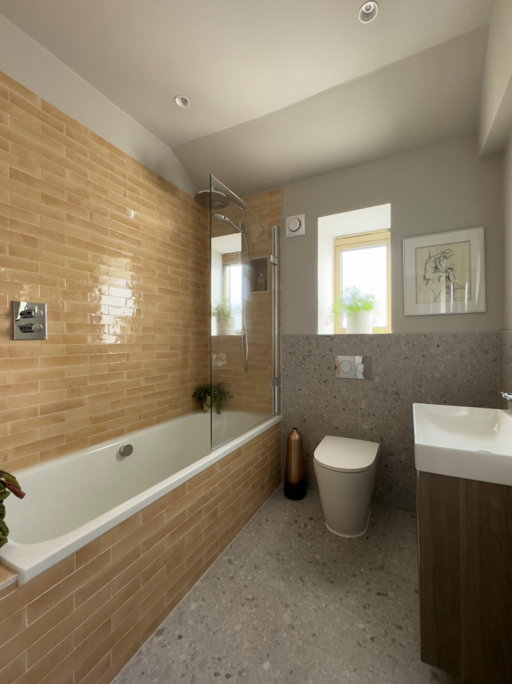 Photo of a small contemporary family bathroom in Other with a built-in bath, a single sink and a floating vanity unit.