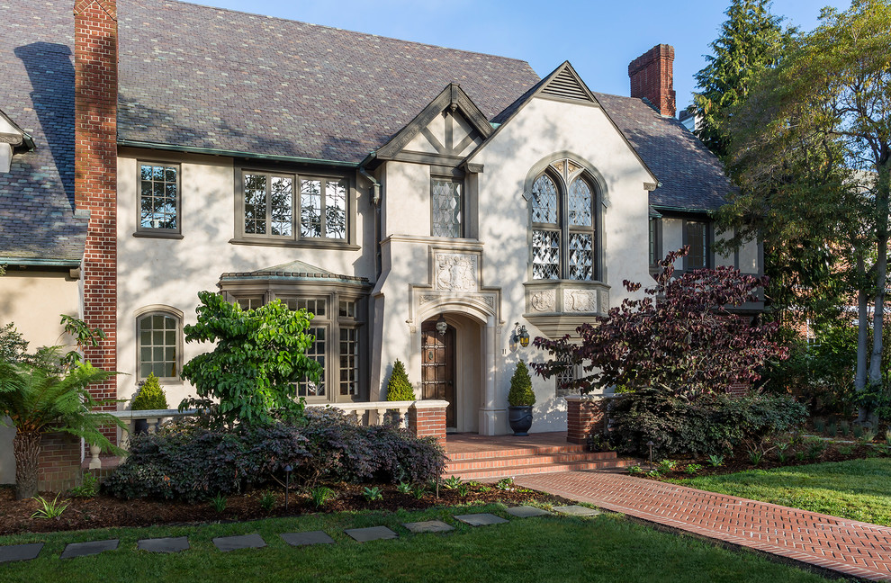 Inspiration for a timeless beige two-story stucco gable roof remodel in San Francisco
