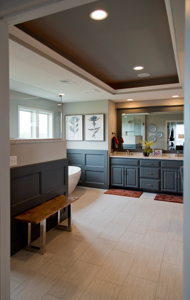 Design ideas for a large transitional master bathroom in Kansas City with louvered cabinets, grey cabinets, a freestanding tub, an open shower, a one-piece toilet, beige walls, ceramic floors, beige floor and an open shower.