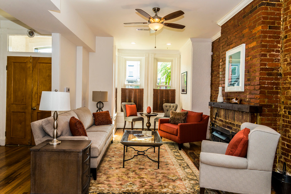 Small traditional formal open concept living room in DC Metro with white walls, light hardwood floors, a standard fireplace, a brick fireplace surround and no tv.