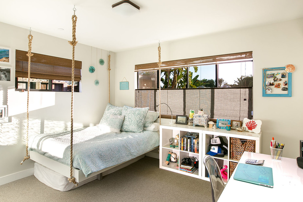 Inspiration for a beach style kids' room for girls in San Diego with grey walls, carpet and grey floor.