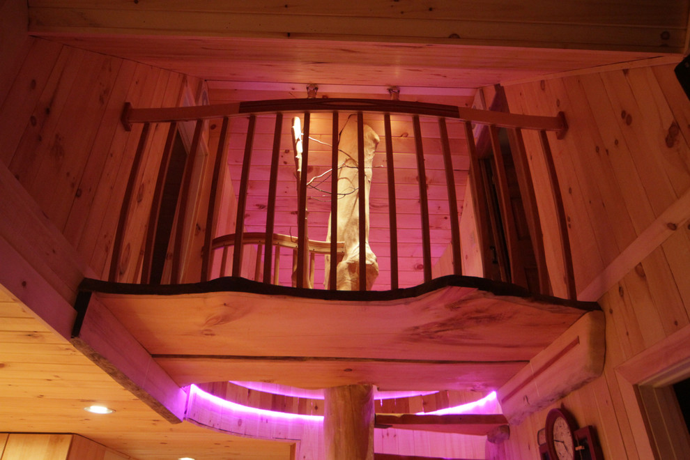 Example of a mid-sized mountain style wooden straight open and wood railing staircase design in Burlington