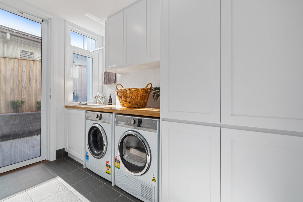Photo of a beach style laundry room in Central Coast.