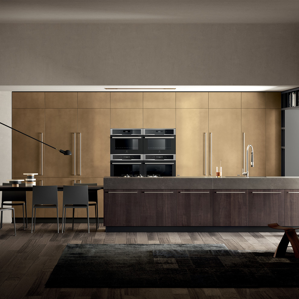 This is an example of an expansive modern single-wall open plan kitchen in Other with flat-panel cabinets, dark wood cabinets, with island and grey benchtop.