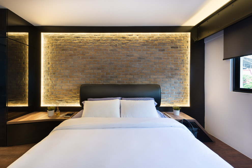 This is an example of a contemporary master bedroom in Singapore with black walls.