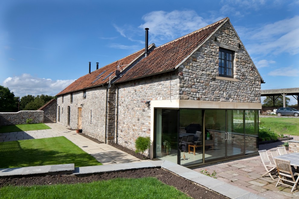 Photo of a transitional two-storey exterior in Gloucestershire with a gable roof.