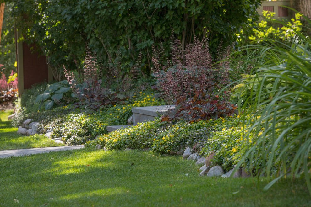 Inspiration for a mid-sized traditional front yard shaded garden for summer in Denver.