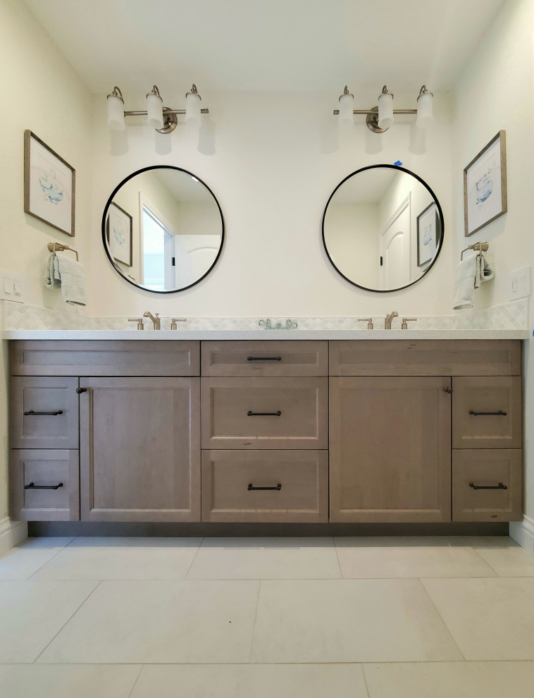 Inspiration for a medium sized classic family bathroom in Orange County with shaker cabinets, medium wood cabinets, an alcove bath, an alcove shower, a one-piece toilet, multi-coloured tiles, porcelain tiles, porcelain flooring, a submerged sink, engineered stone worktops, beige floors, white worktops, double sinks and a built in vanity unit.