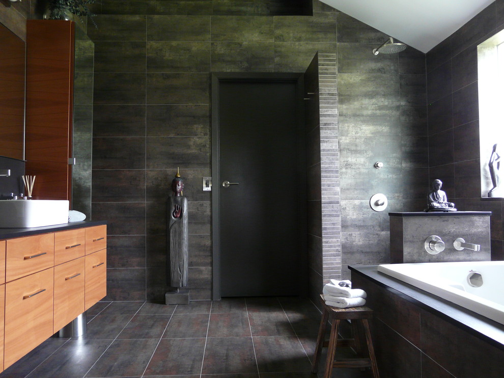 This is an example of a contemporary bathroom in Houston with an open shower and a vessel sink.
