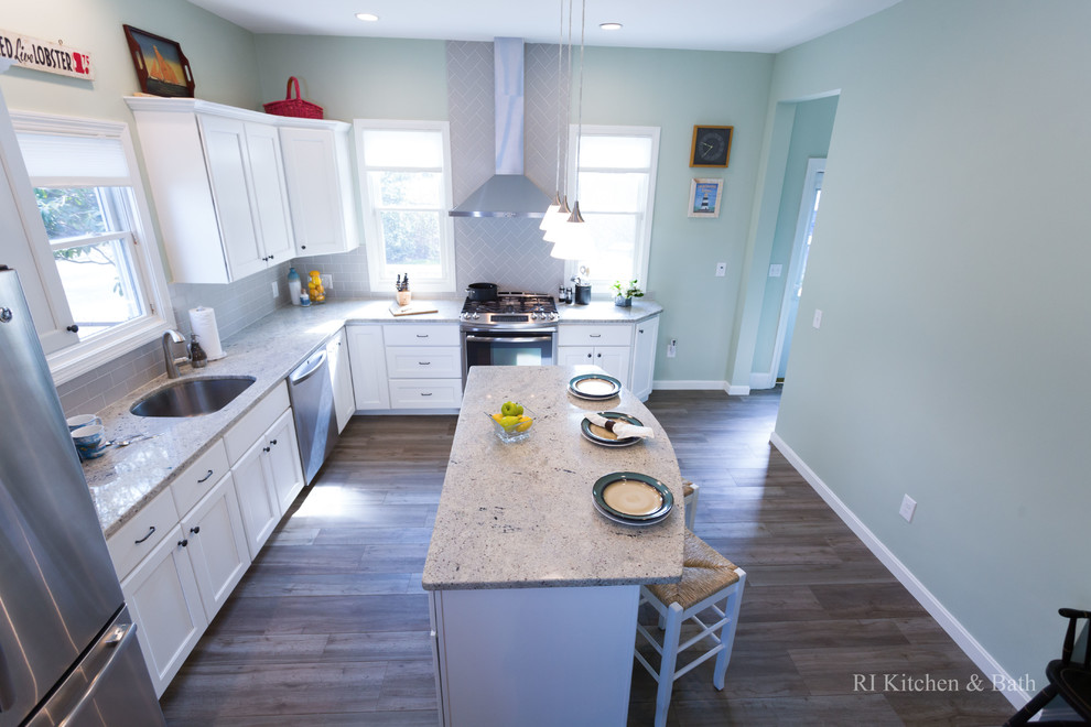 Example of a large transitional l-shaped porcelain tile eat-in kitchen design in Providence with an undermount sink, recessed-panel cabinets, white cabinets, granite countertops, gray backsplash, ceramic backsplash, stainless steel appliances, green walls and an island