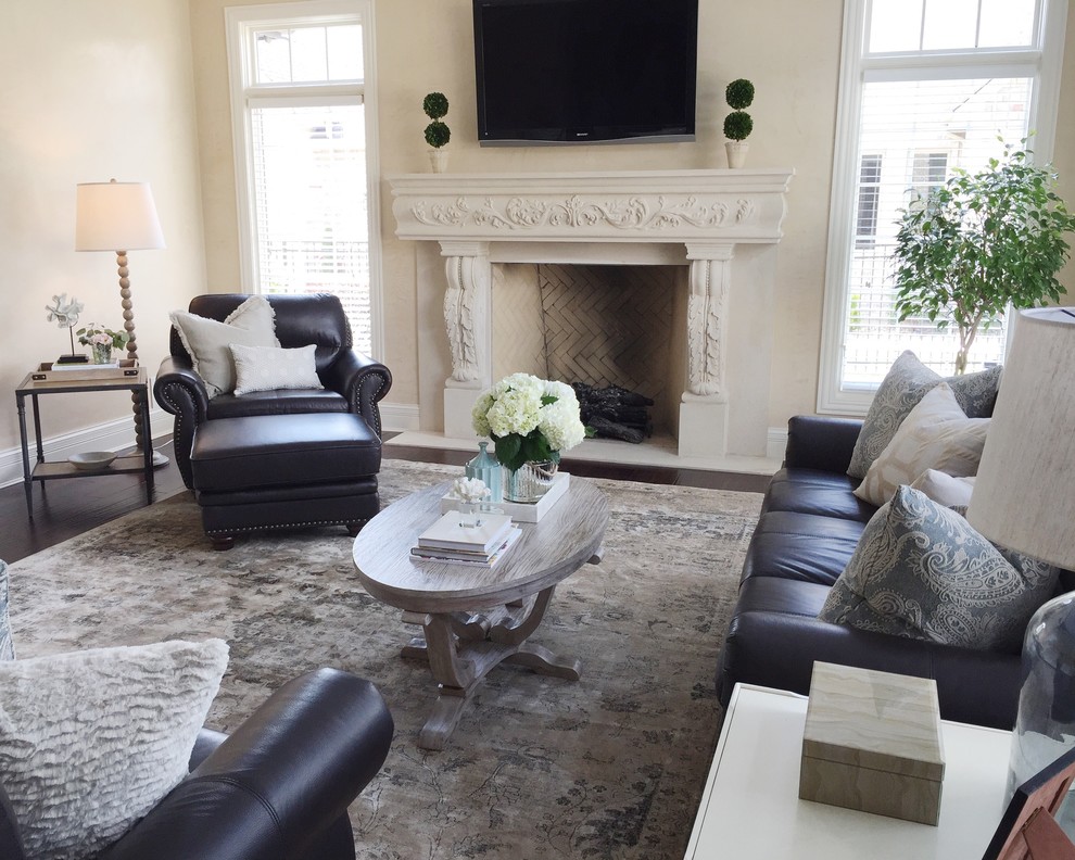 Large traditional enclosed family room in Chicago with beige walls, dark hardwood floors, a standard fireplace, a stone fireplace surround and a wall-mounted tv.