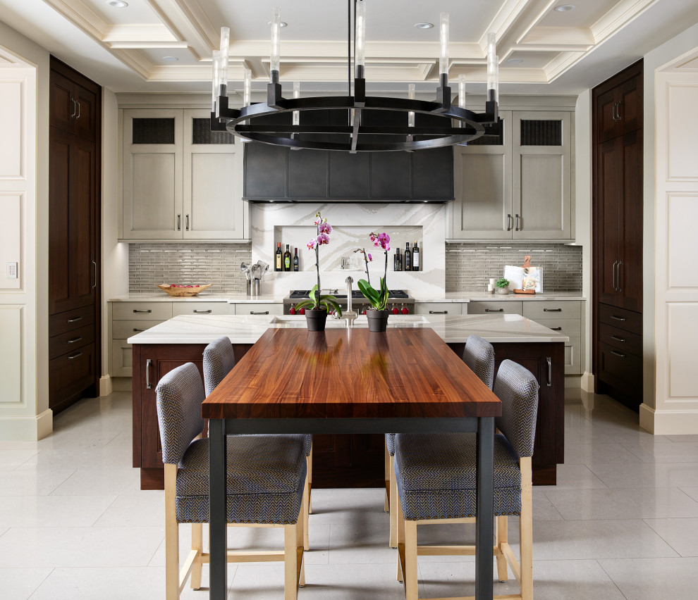 Example of a transitional porcelain tile, white floor and coffered ceiling kitchen design in Denver with stainless steel appliances and white countertops